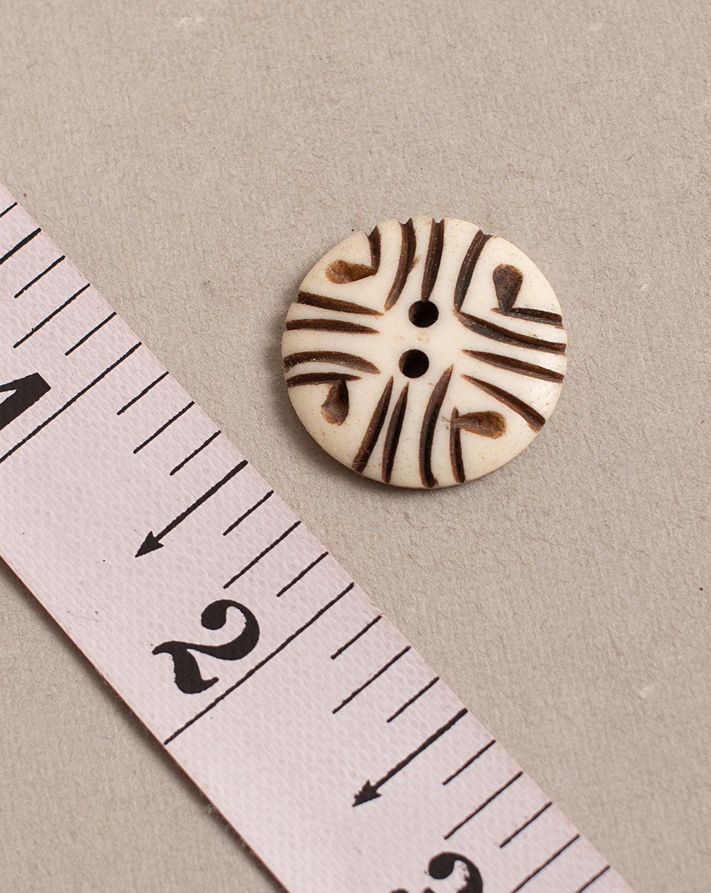 Hand Carved Bone Button ( Single Piece ) - Fabriclore.com