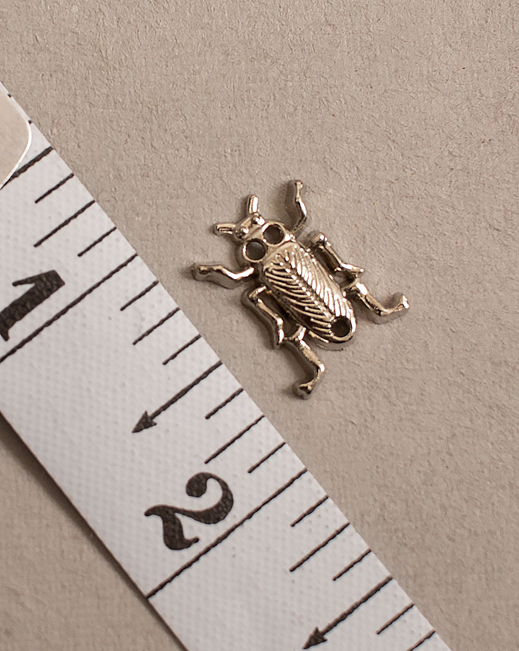 Antique Metal Casting Charm - Fabriclore.com
