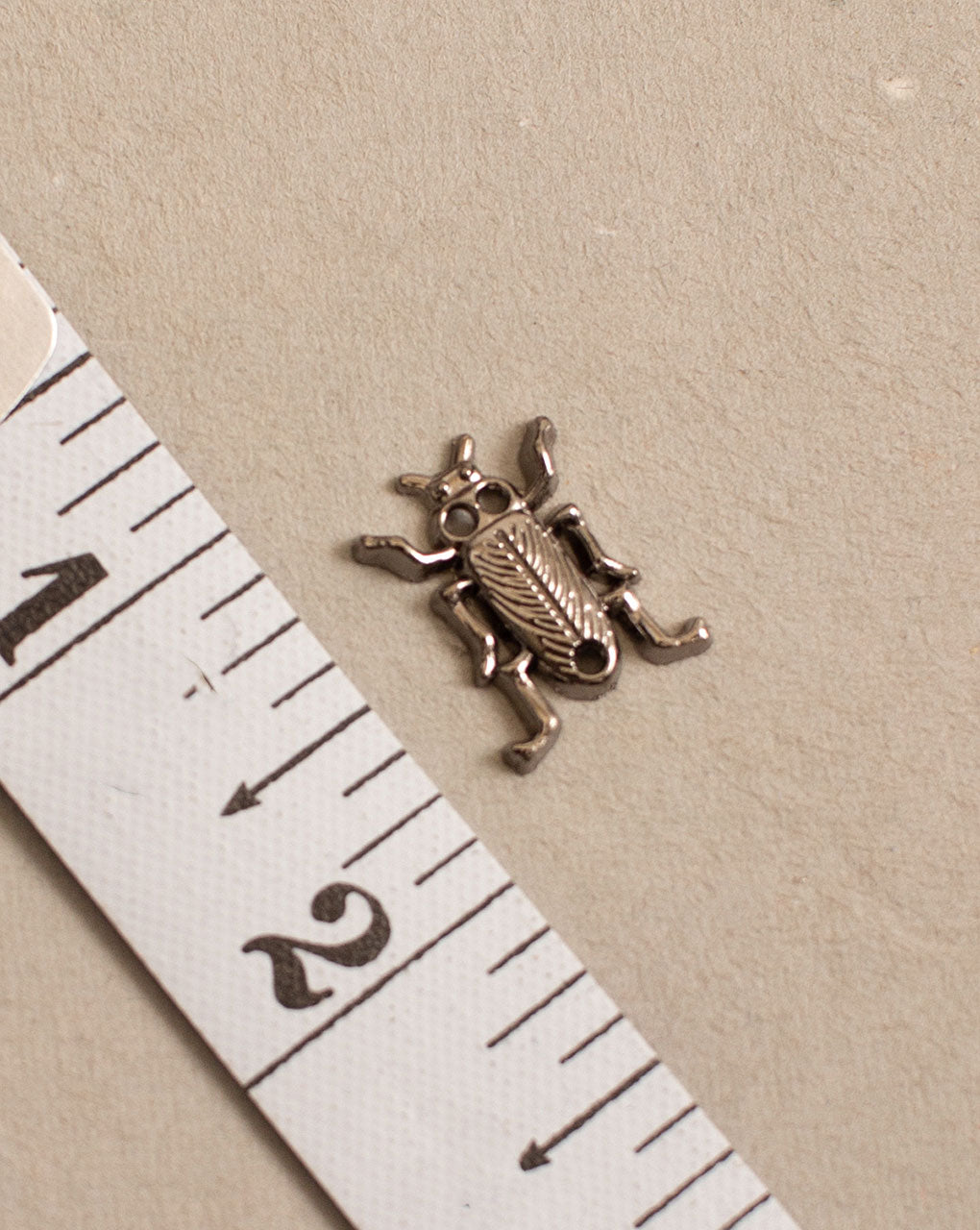 Antique Metal Casting Charm - Fabriclore.com