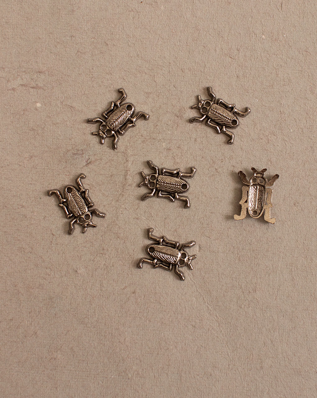 Antique Metal Casting Charm - Fabriclore.com