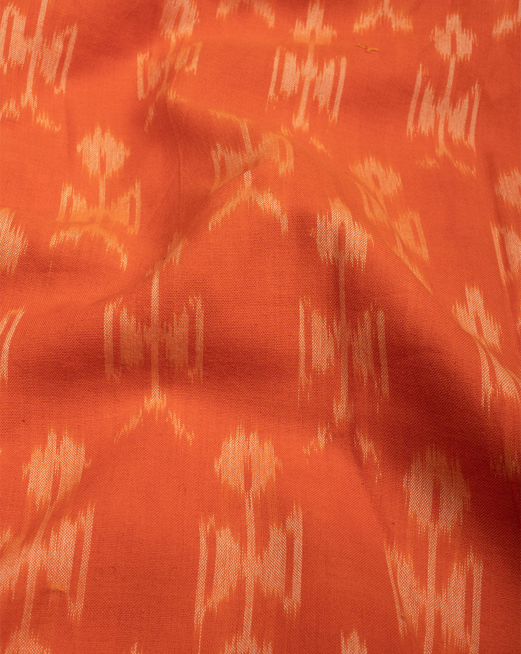 Orange & Off-White Warli Pattern Woven Mercerized Ikat Cotton Fabric - Fabriclore.com