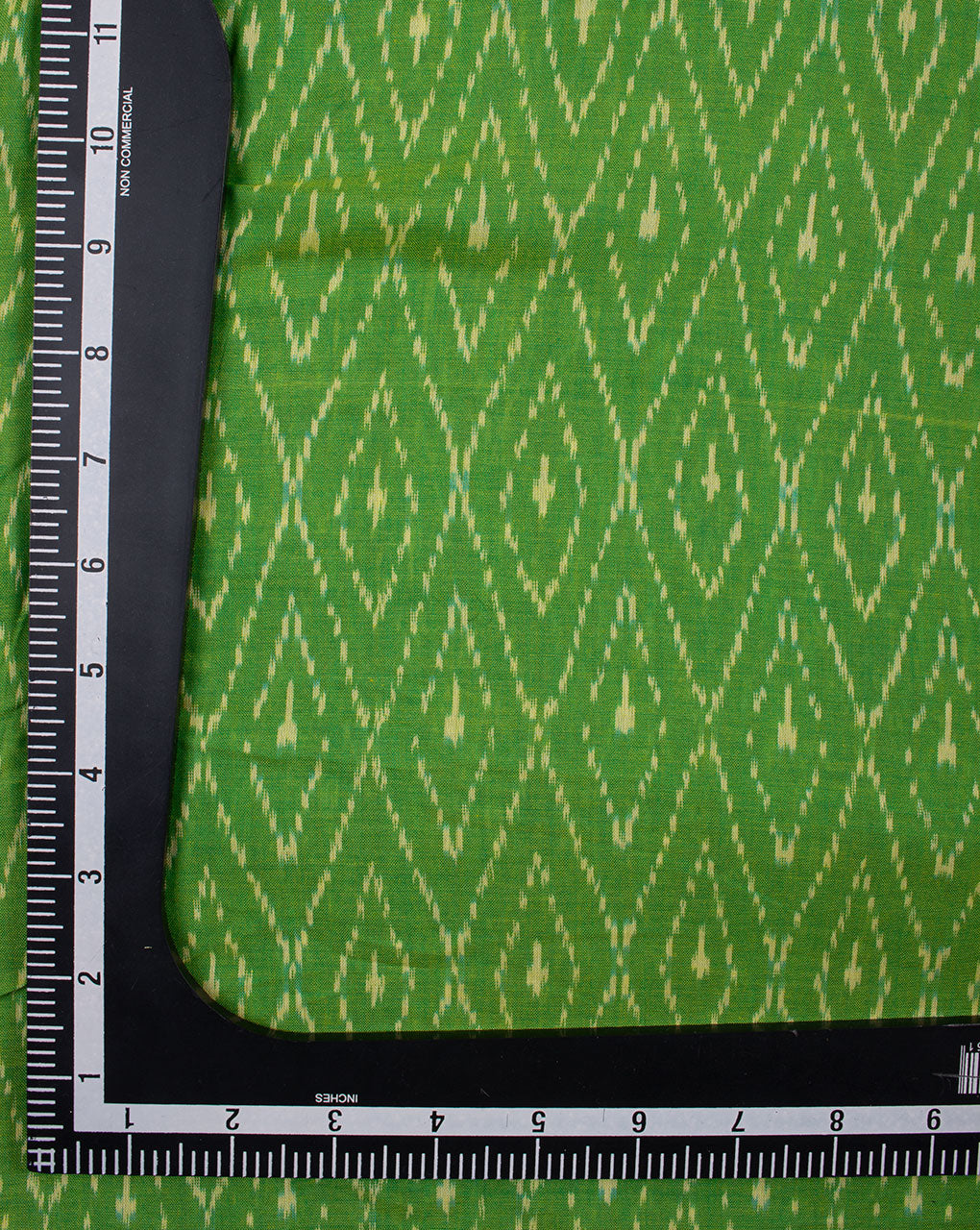 Green & Off-White Chevron Pattern Woven Mercerized Ikat Cotton Fabric - Fabriclore.com